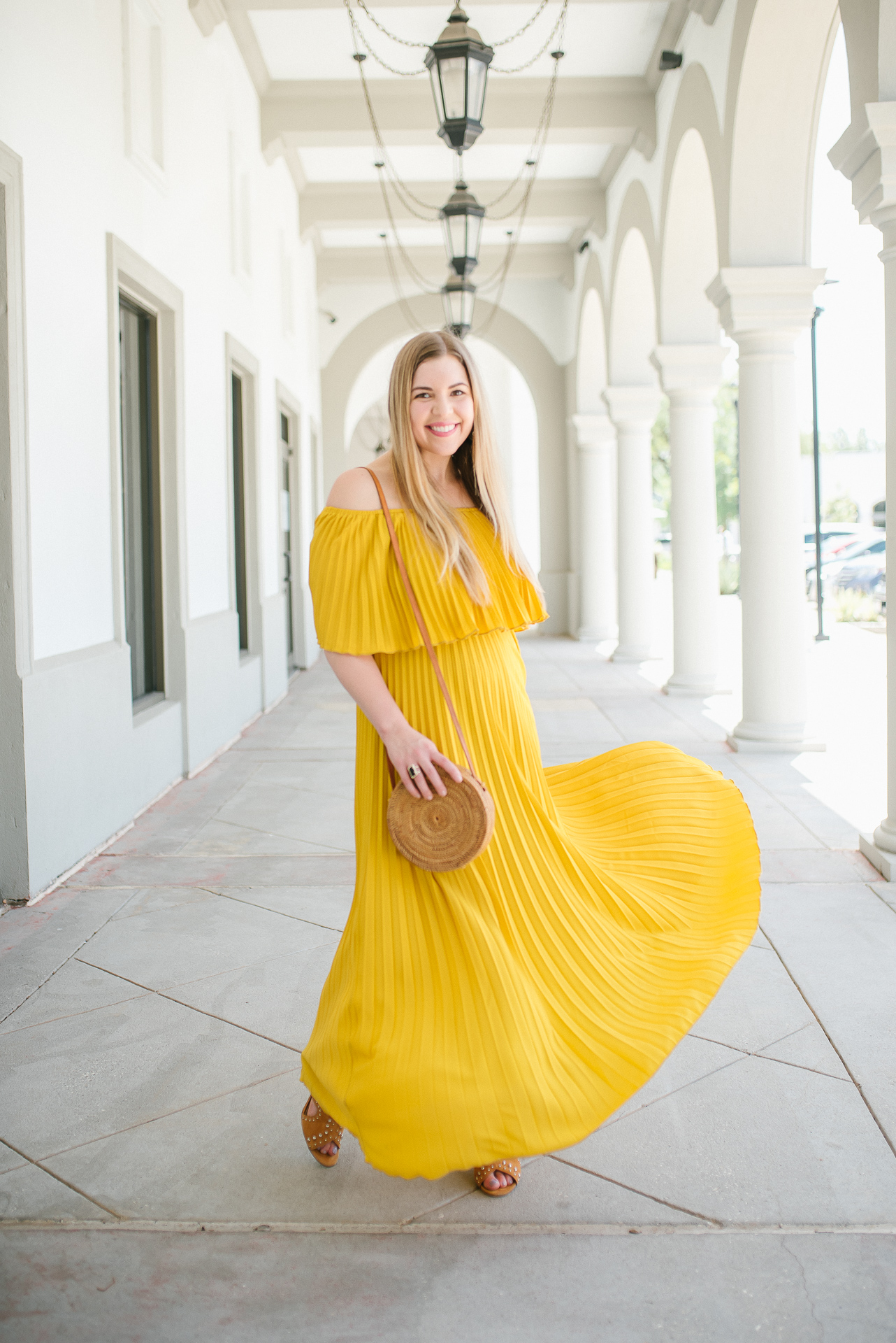 8 Amazing Dresses for Summer Travel - Yellow Pleated Maxi Dress worn by Cup of Charisma Jillian Goltzman Houston Fashion Blogger 1
